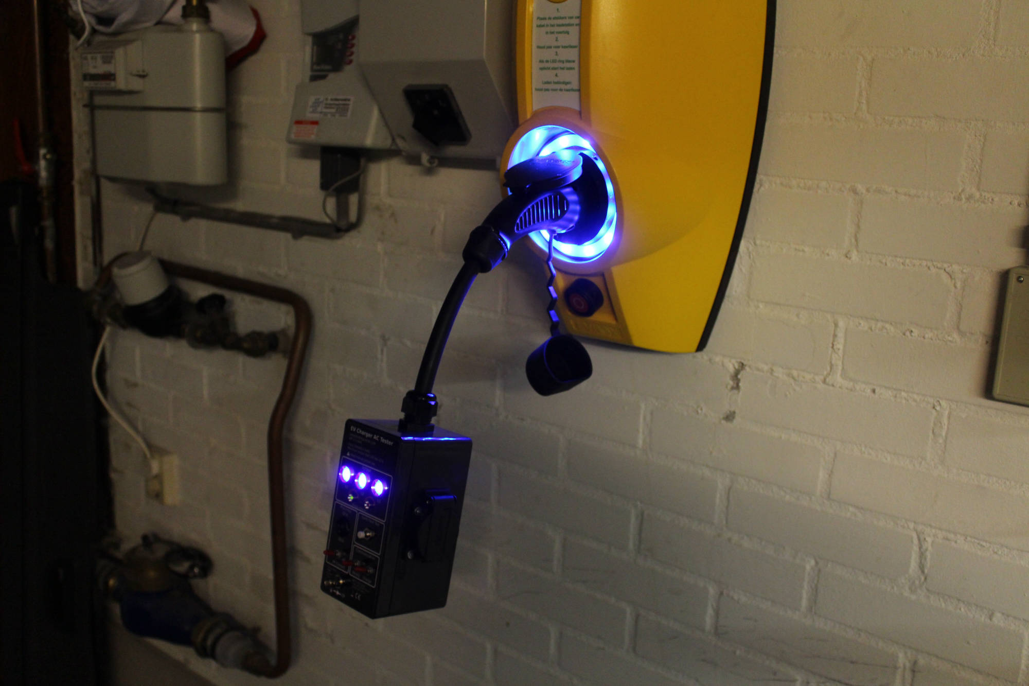 Chargin station in garage is tested with EVSE tester