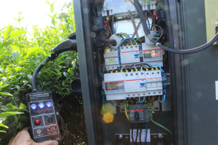 EVSE tester and inside view of charging station